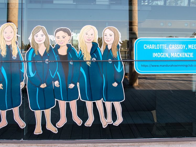Image of Illustration of six girls in blue swim robes on a glass wall, next to a blue sign listing the names Charlotte, Cassidy, Megan, Imogen, and Mackenzie with a swimming club website link below.